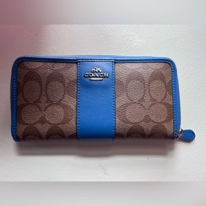 Gently used Coach wallet. Brown signature with blue accent.